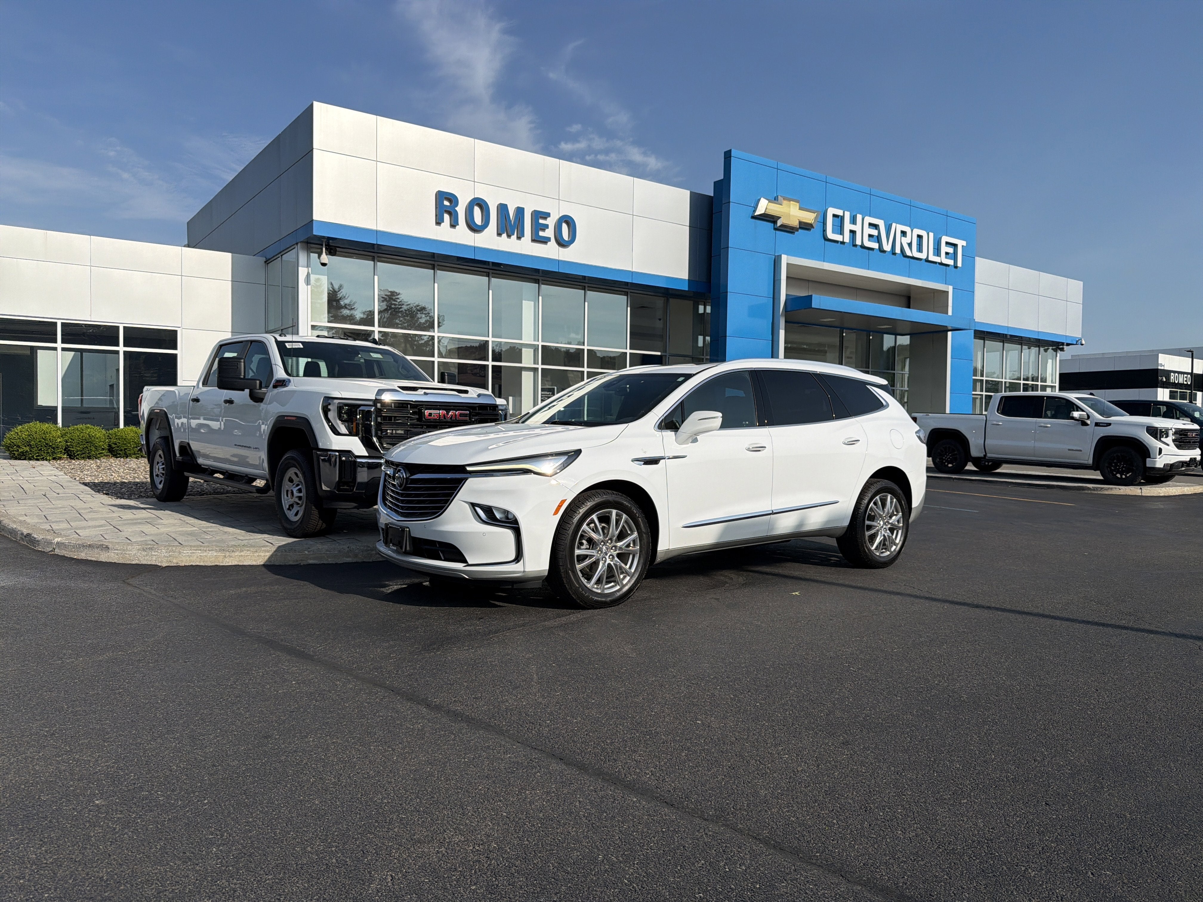 2023 Buick Enclave Essence in Summit White — front three-quarter view