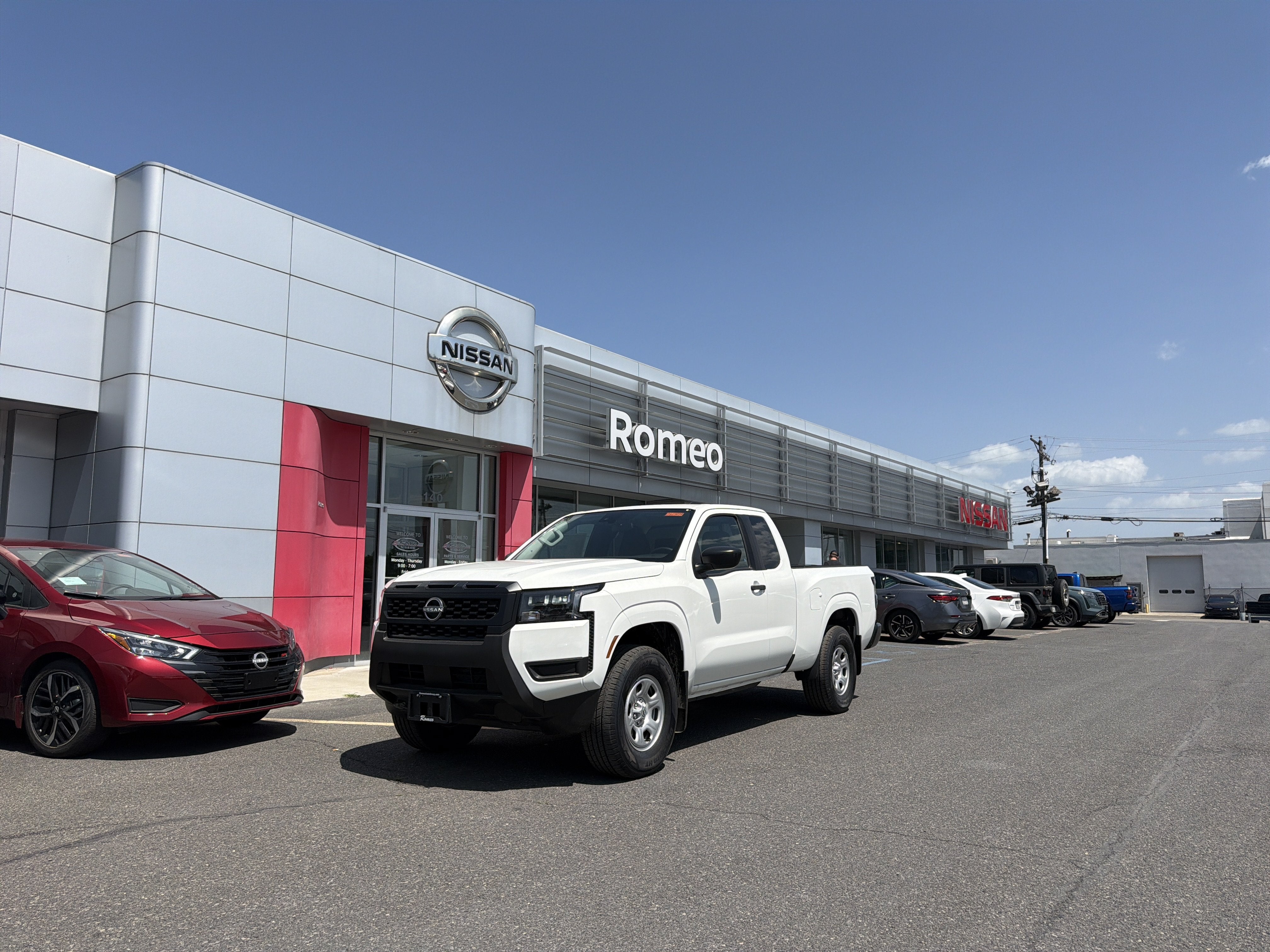 2026 Nissan Frontier S in Glacier White — front three-quarter view