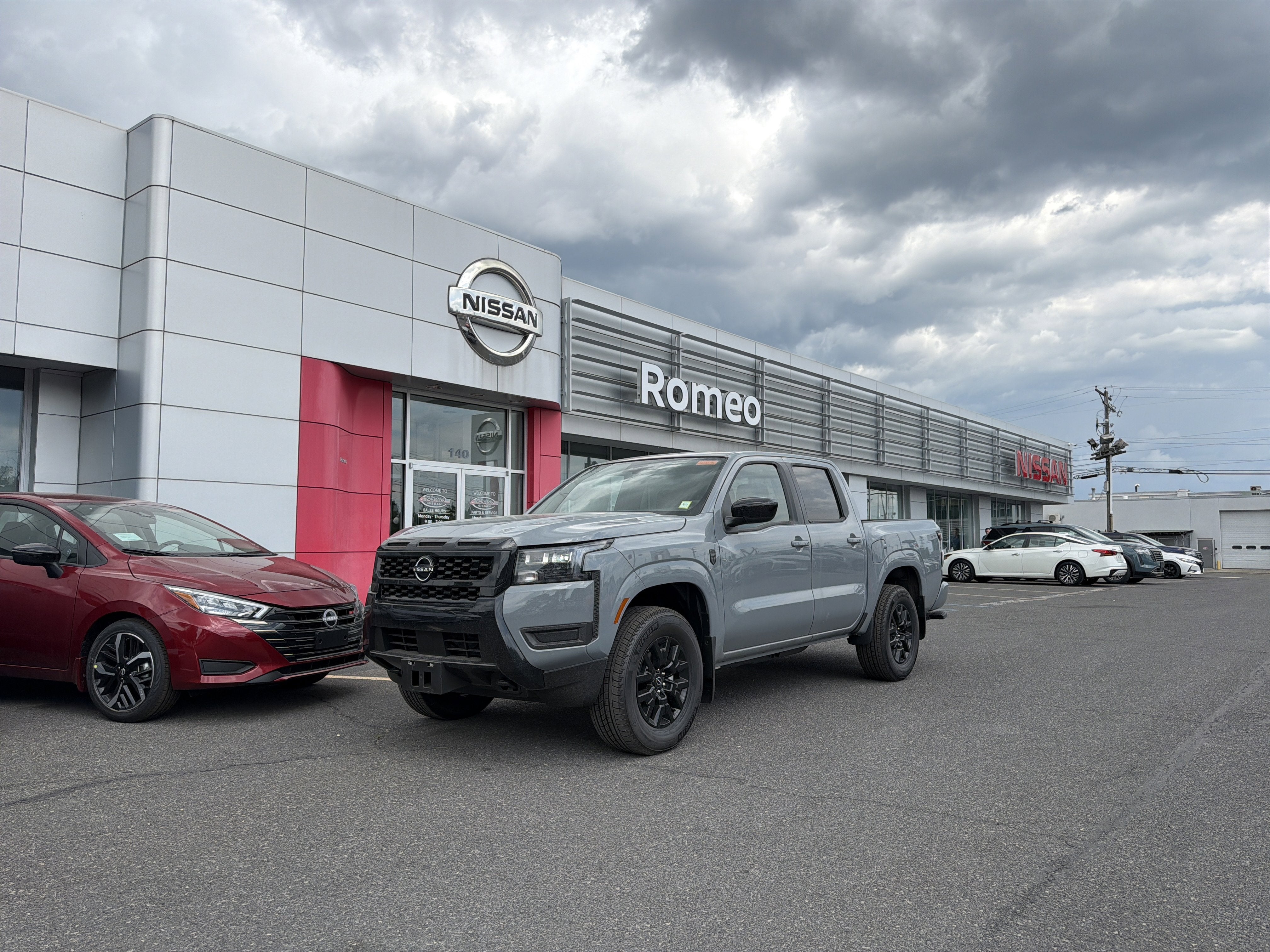 2026 Nissan Frontier SV in Boulder Gray Pearl — front three-quarter view