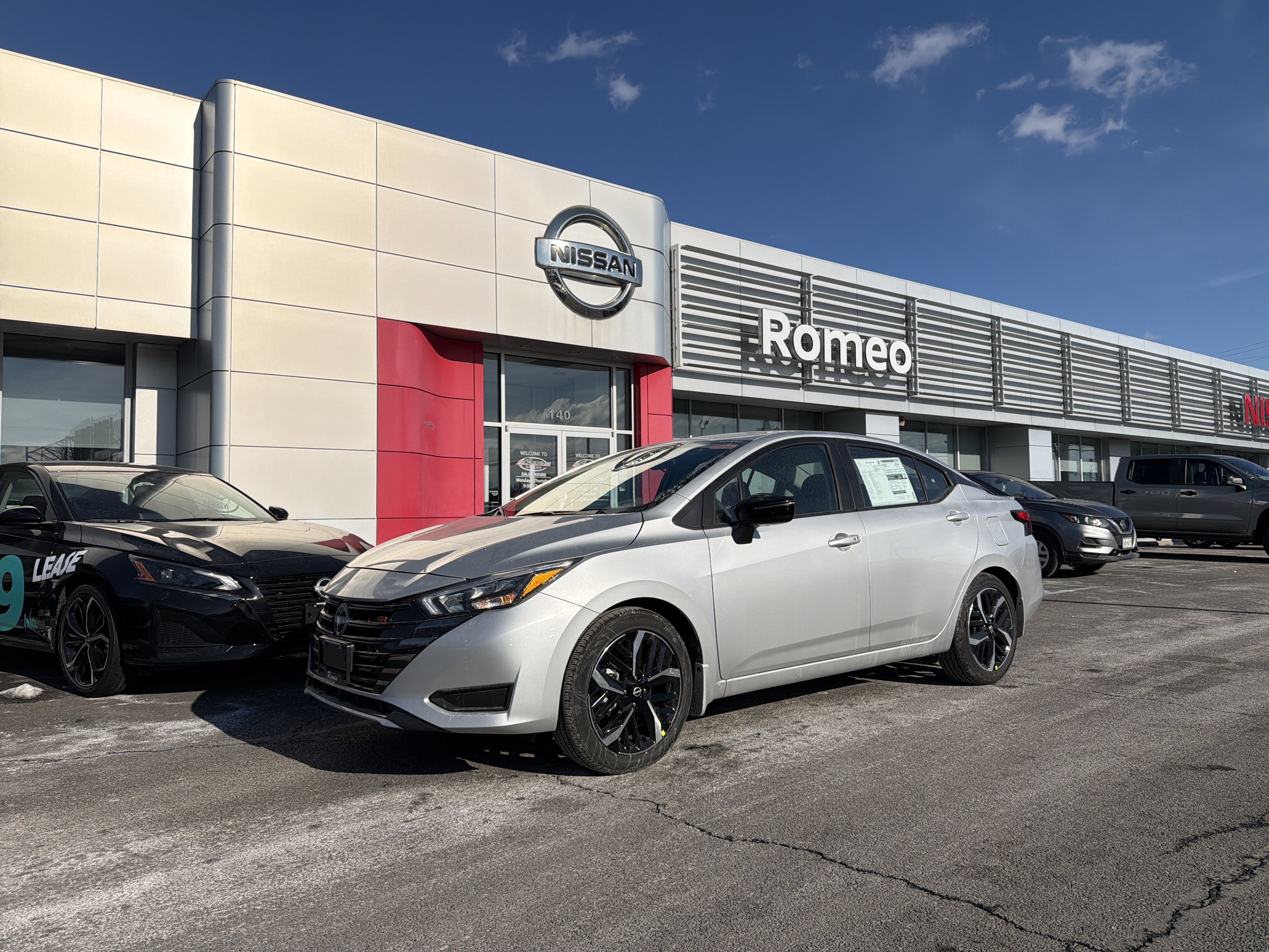 2025 Nissan Versa SR in Brilliant Silver Metallic — front three-quarter view