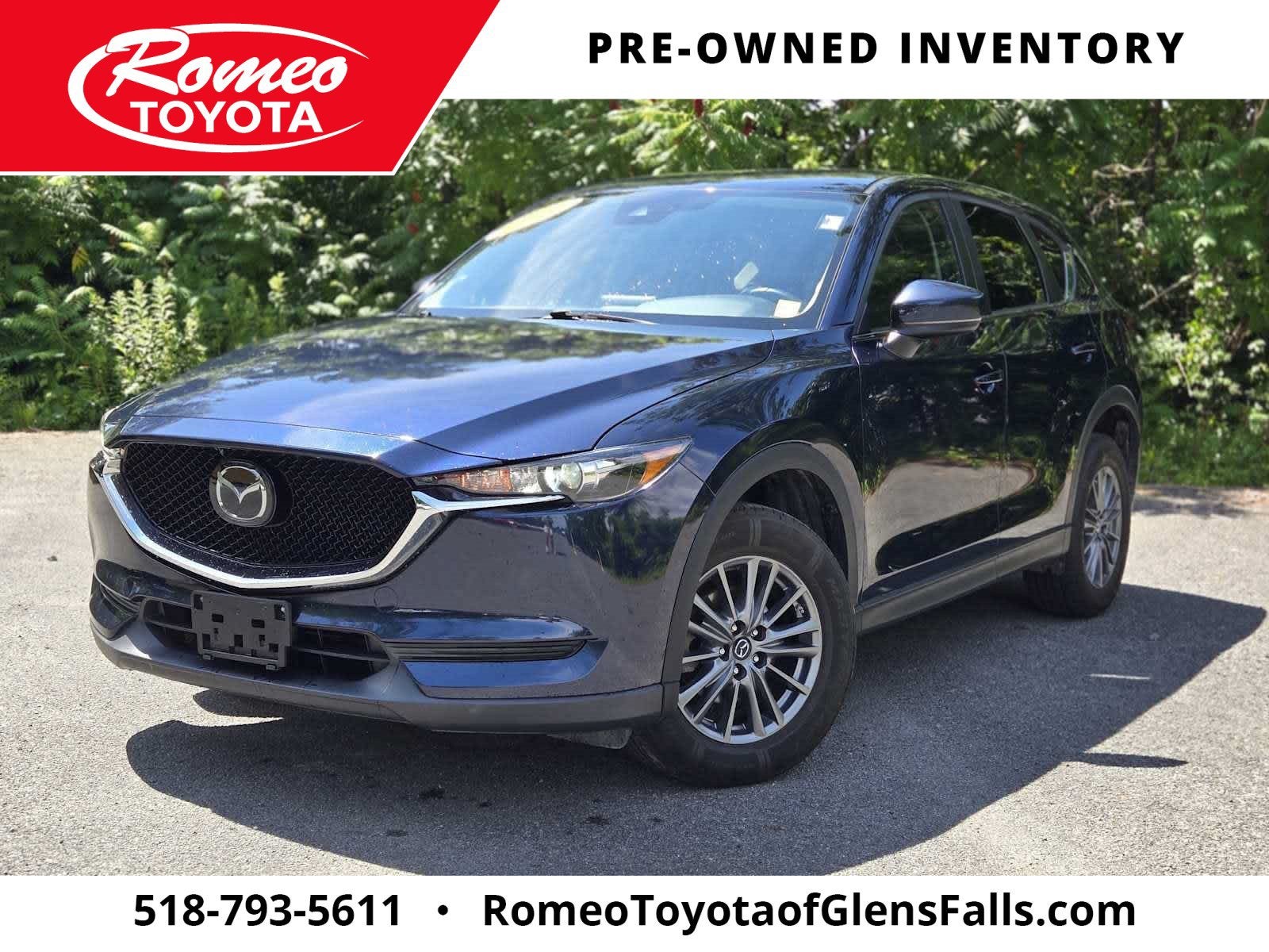 2020 Mazda Mazda CX-5 Touring in Deep Crystal Blue Mica — front three-quarter view