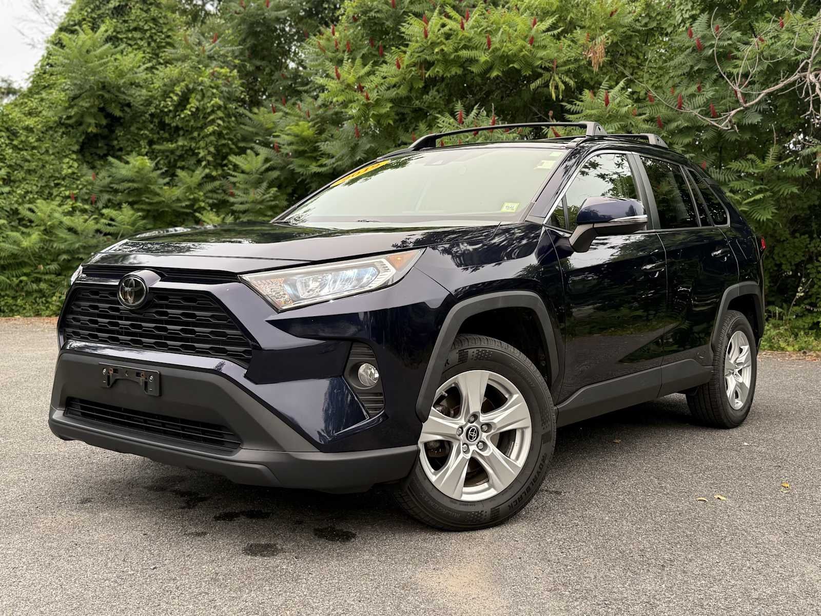 2019 Toyota RAV4 XLE in Blueprint — front three-quarter view