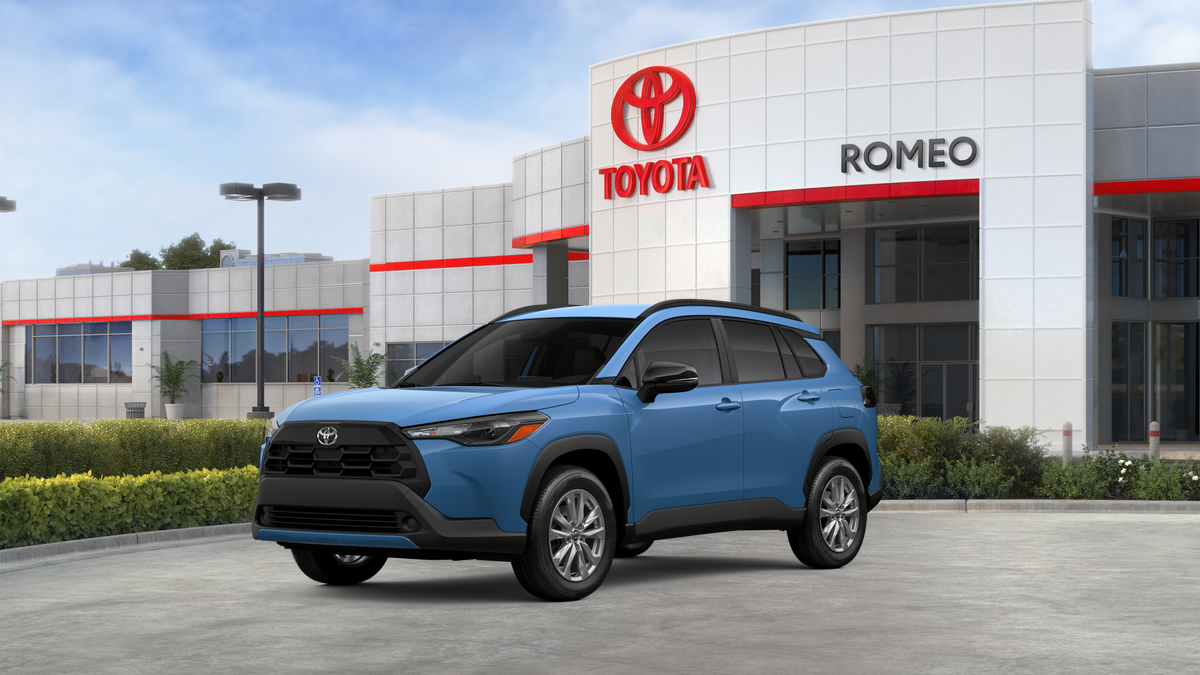 2026 Toyota Corolla Cross LE in Cavalry Blue — front three-quarter view