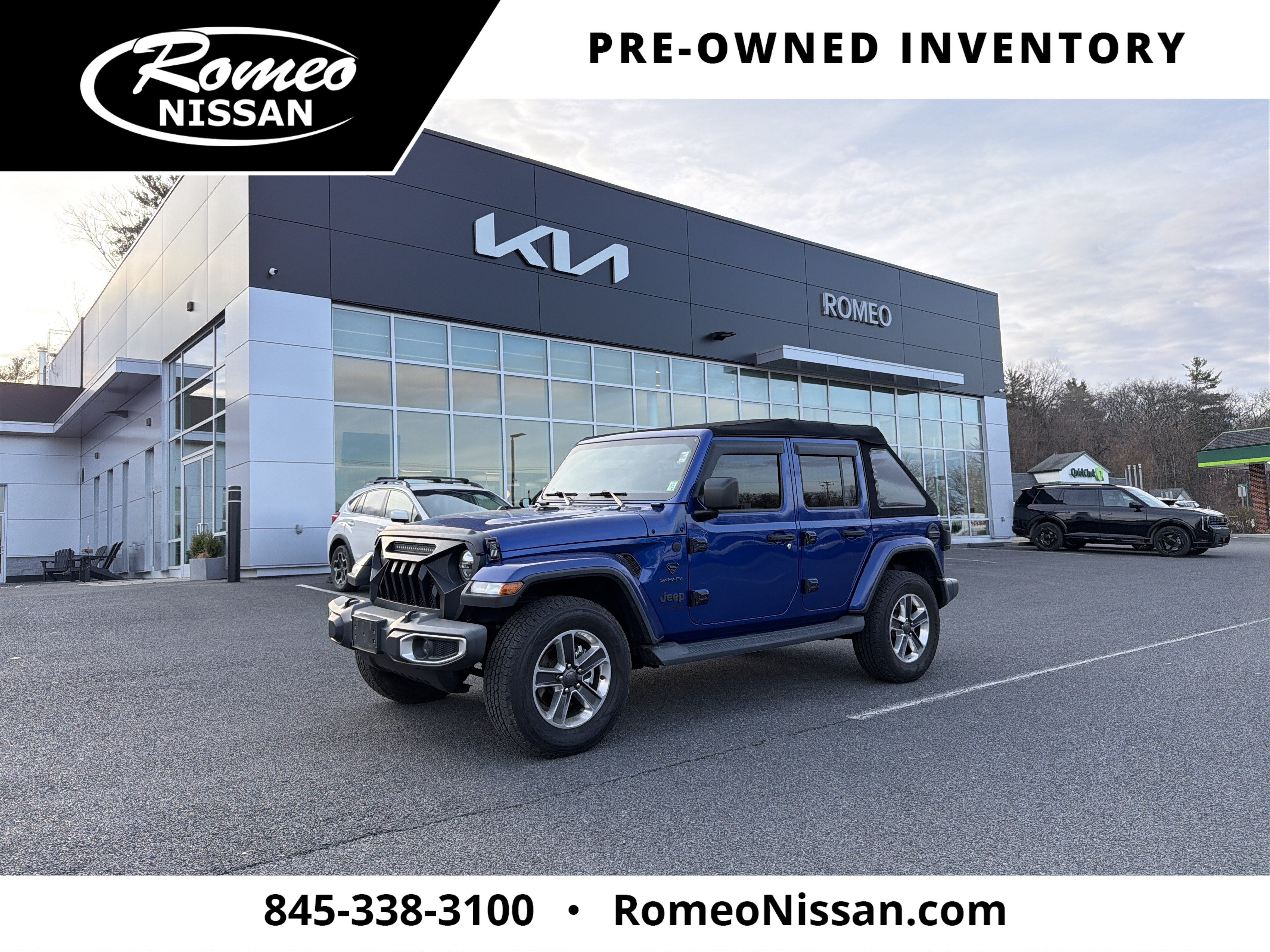 2018 Jeep Wrangler Unlimited Sahara in Ocean Blue Metallic Clearcoat — front three-quarter view