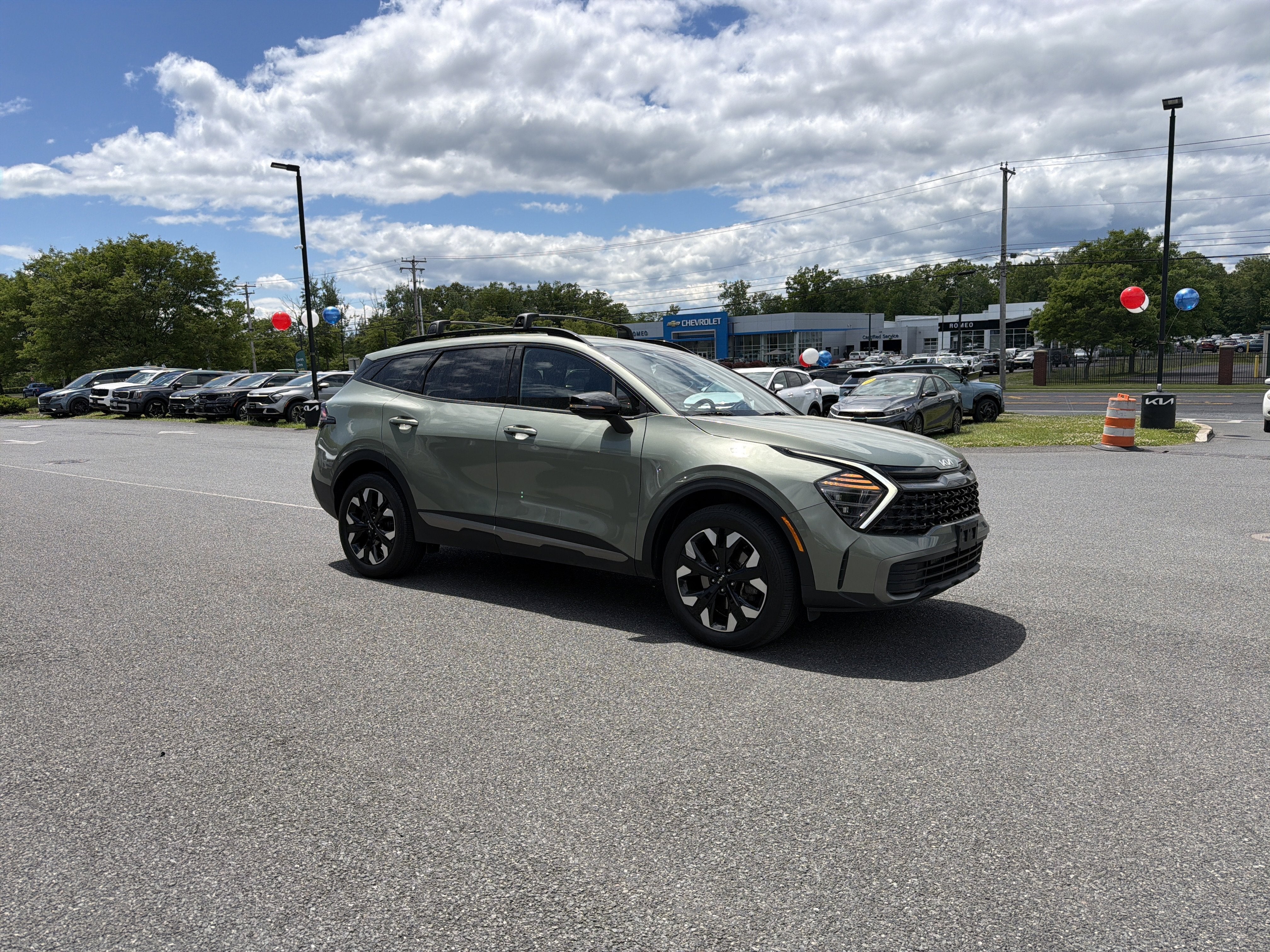 2024 Kia Sportage — rear three-quarter view