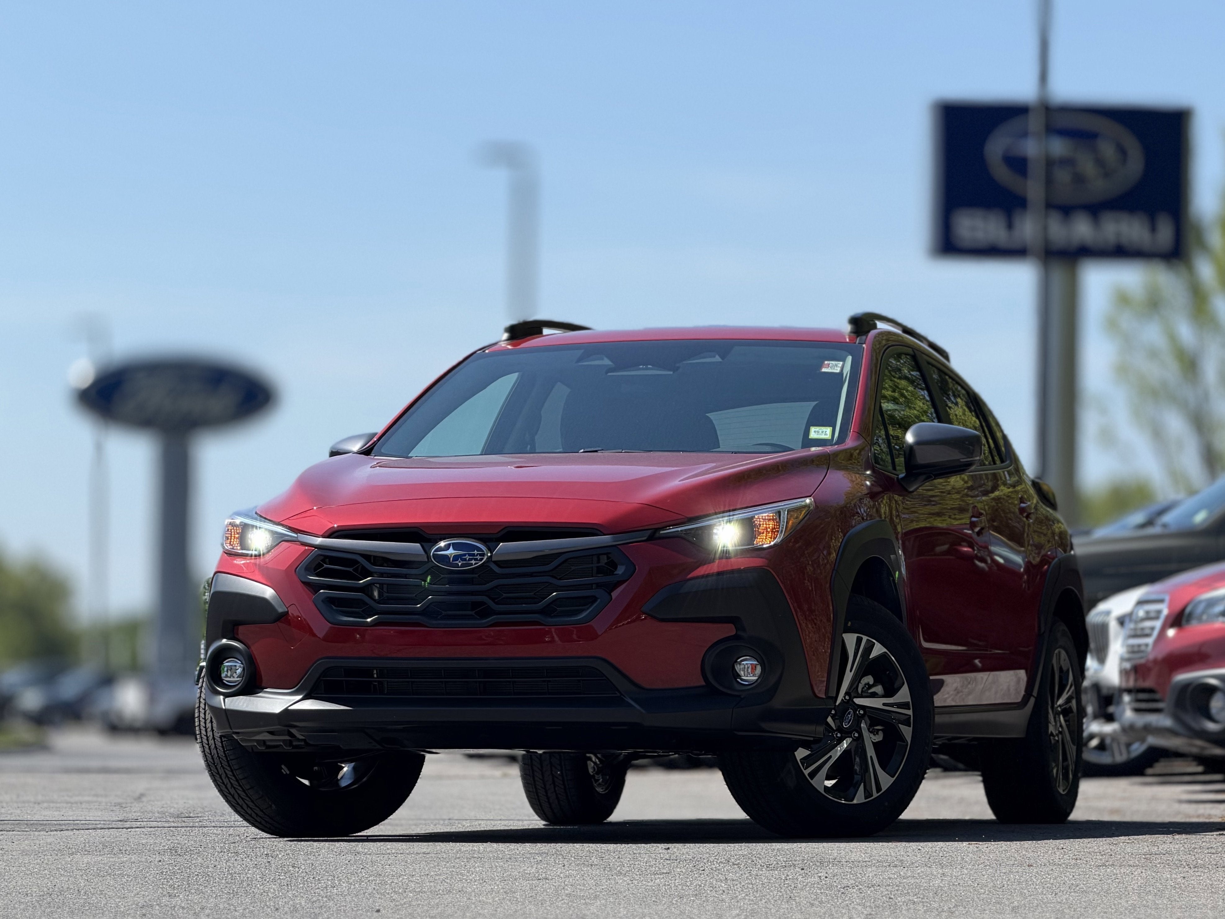 2026 Subaru CROSSTREK Premium in Lithium Red Pearl — front three-quarter view