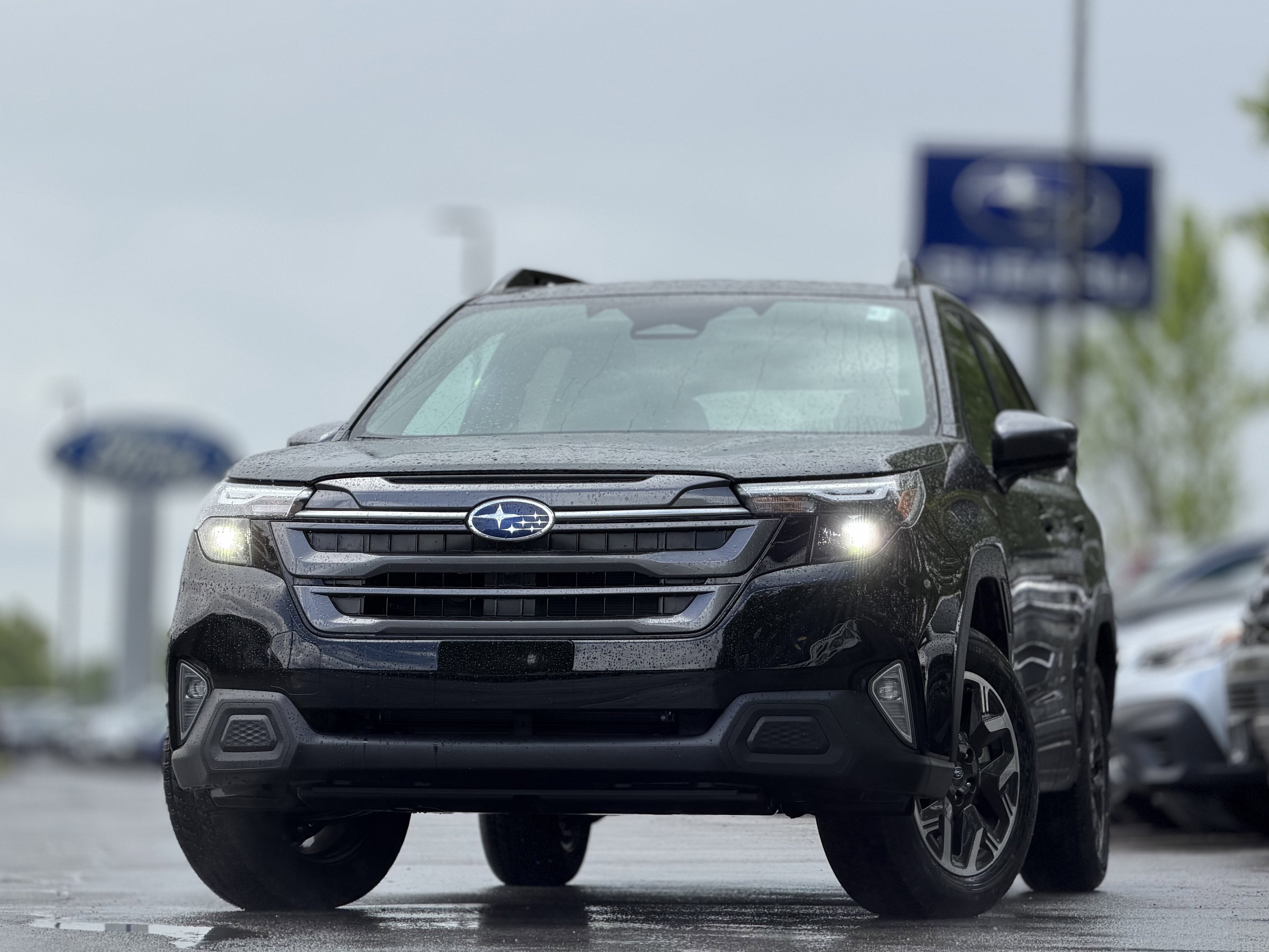 2026 Subaru FORESTER Premium in Crystal Black Silica — front three-quarter view