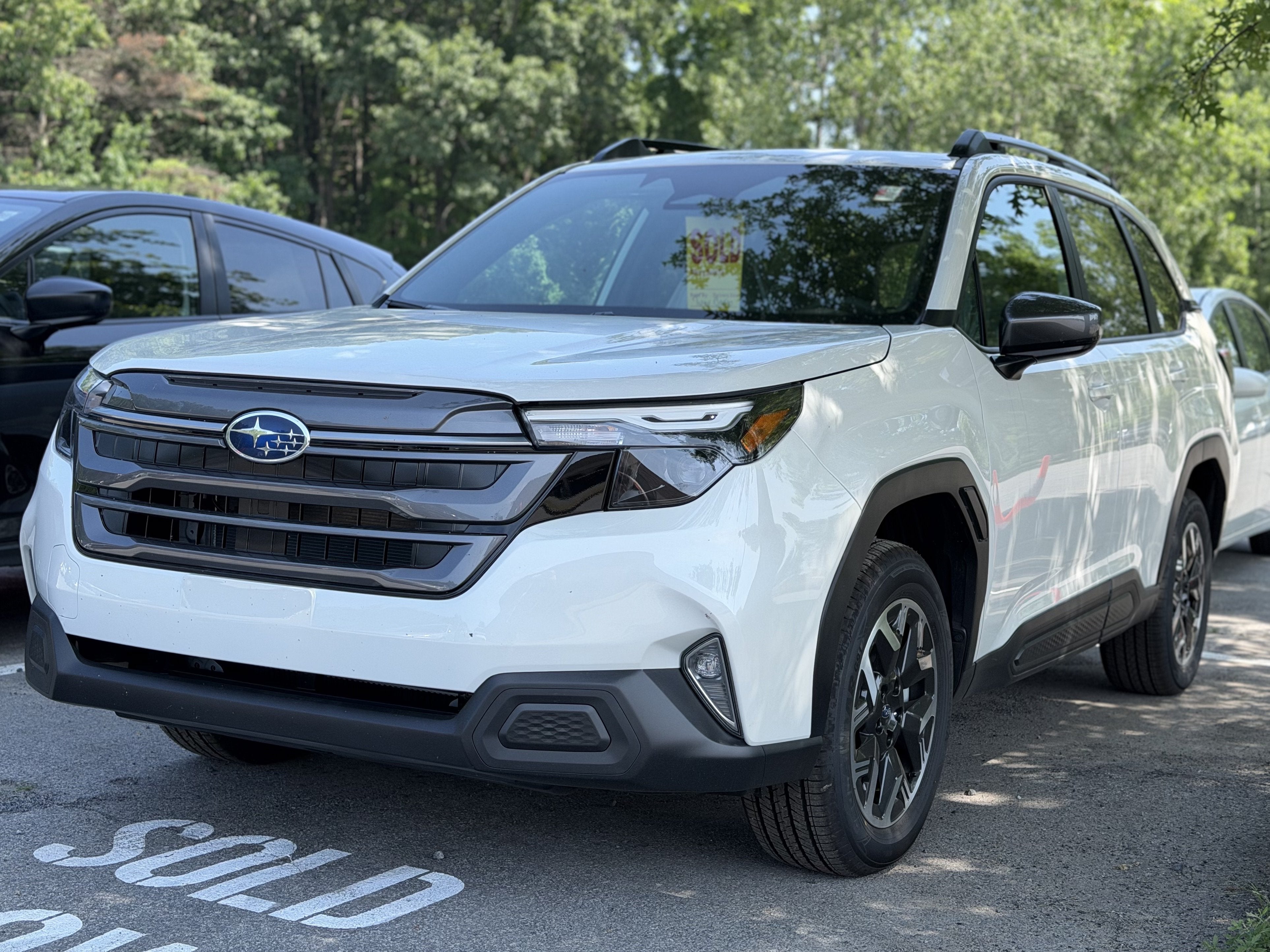 2026 Subaru FORESTER Premium in Crystal White Pearl — front three-quarter view