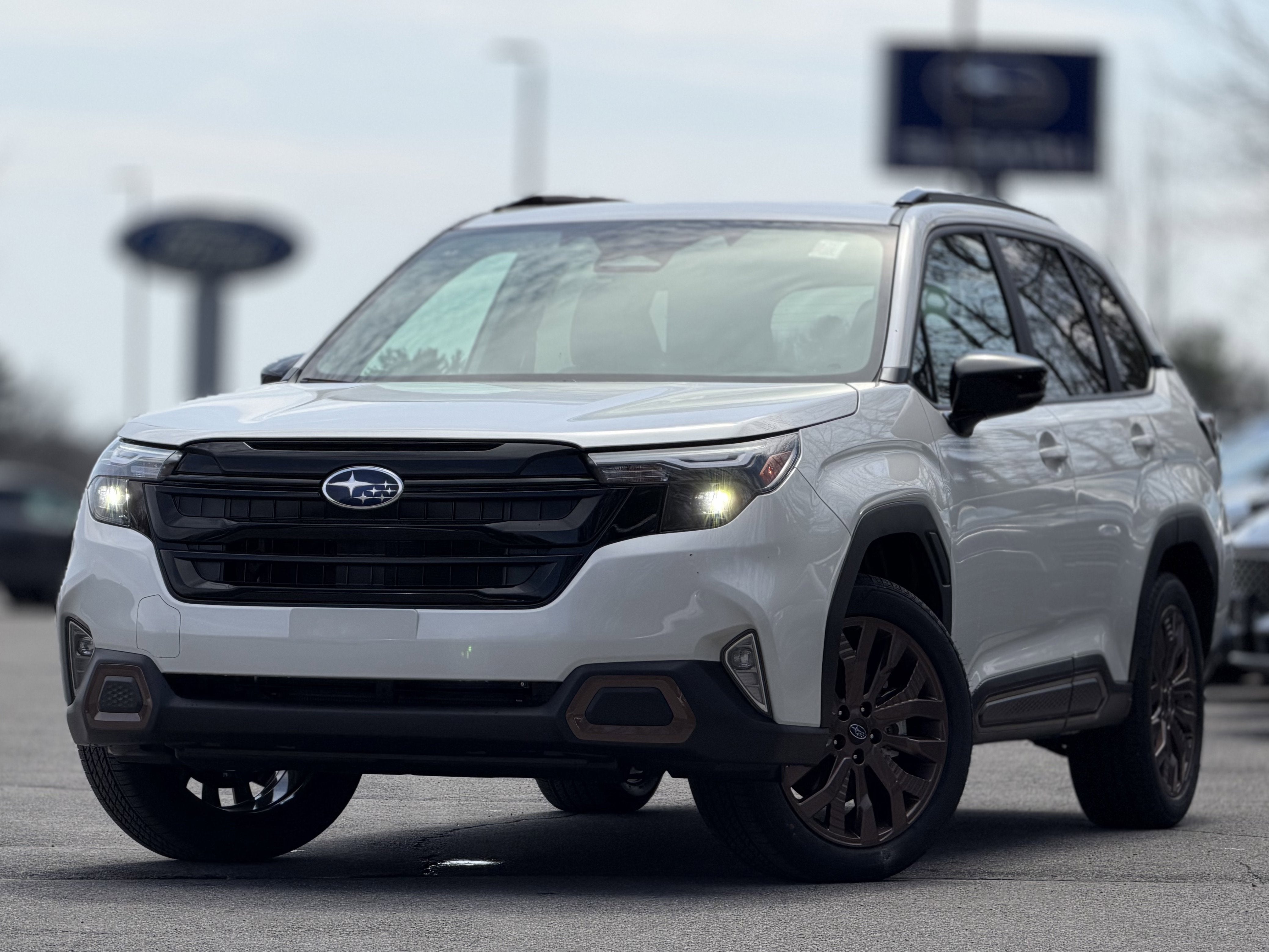 2026 Subaru FORESTER Sport in Crystal White Pearl — front three-quarter view