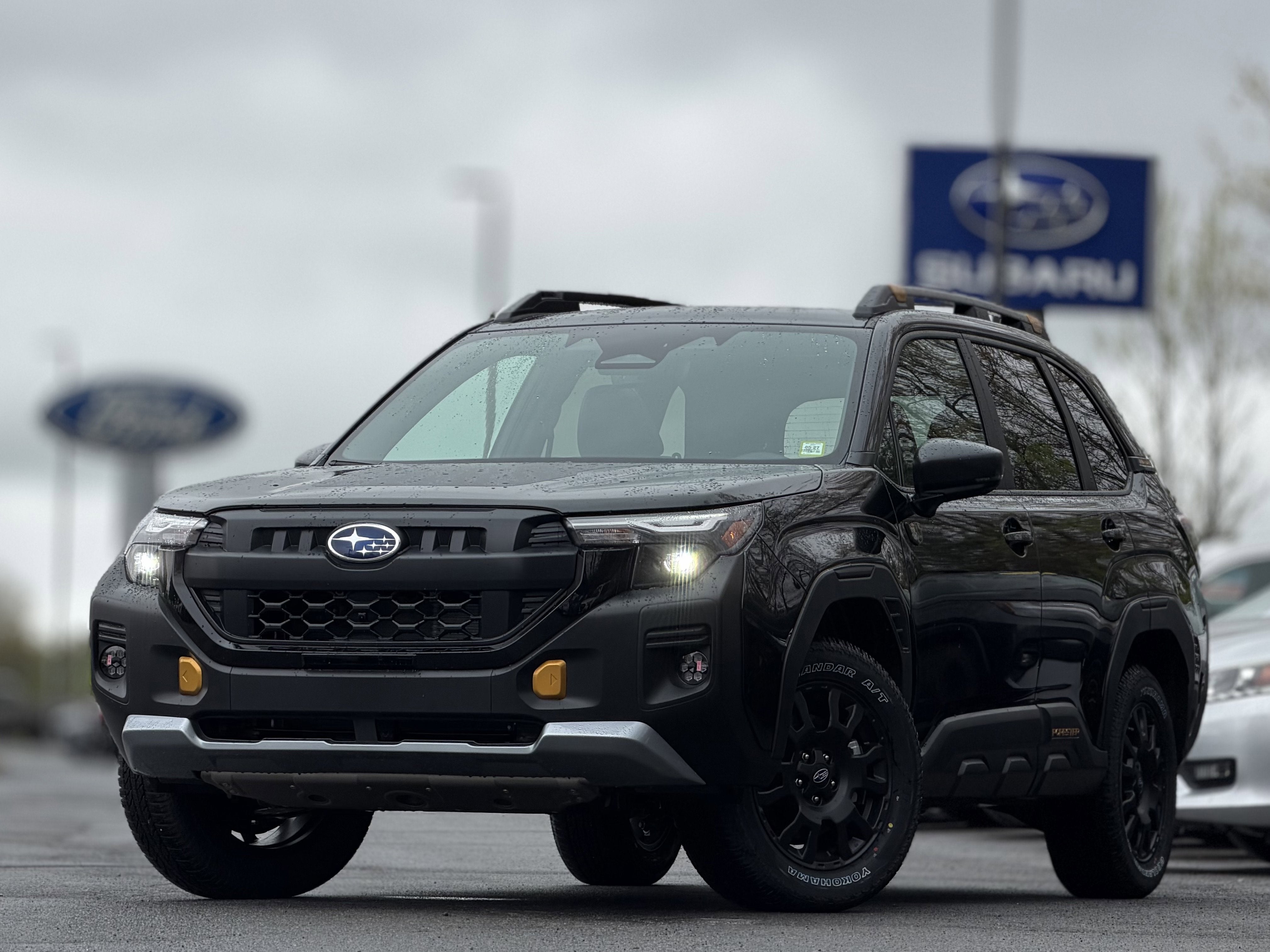 2026 Subaru FORESTER Wilderness in Crystal Black Silica — front three-quarter view