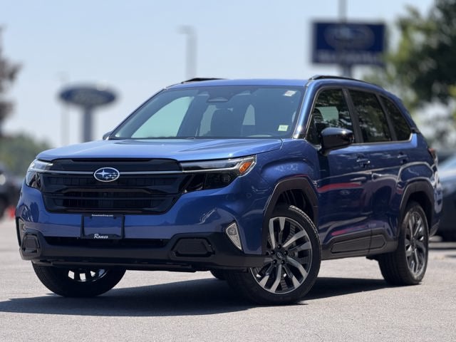 2026 Subaru FORESTER Touring in Daybreak Blue Pearl — front three-quarter view