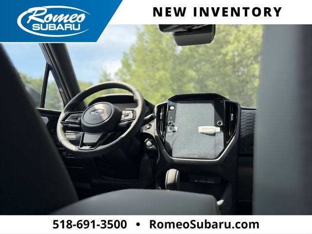2026 Subaru FORESTER Touring in Daybreak Blue Pearl — front three-quarter view