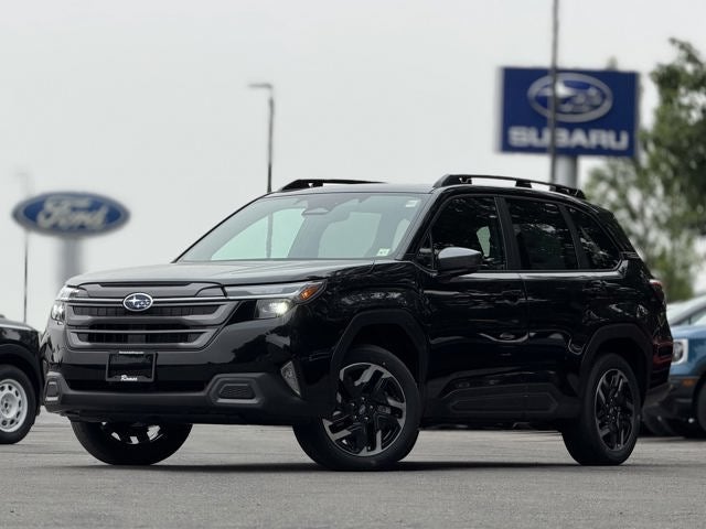 2026 Subaru FORESTER Touring in Crystal Black Silica — front three-quarter view