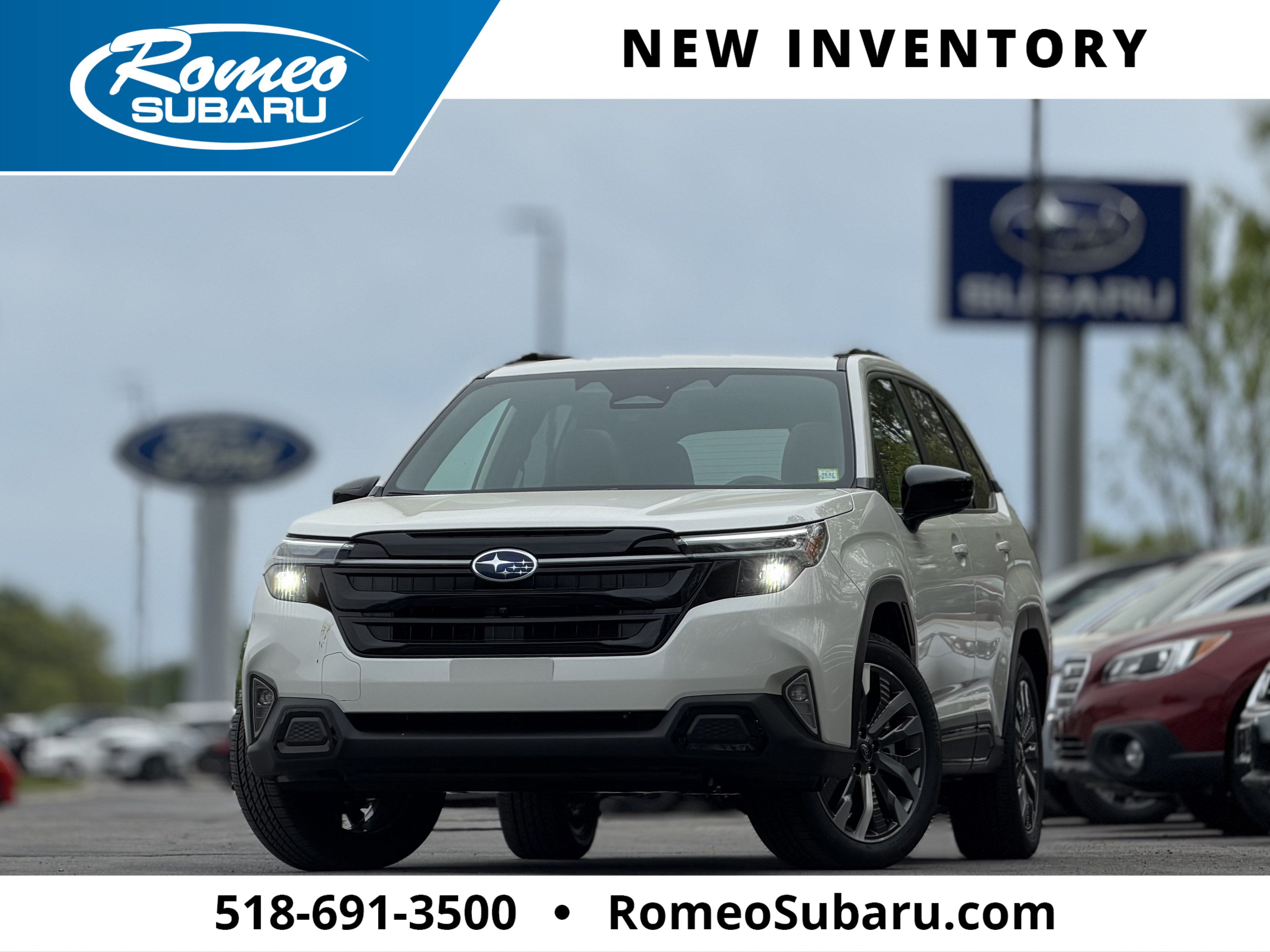 2026 Subaru FORESTER Touring in Crystal White Pearl — front three-quarter view