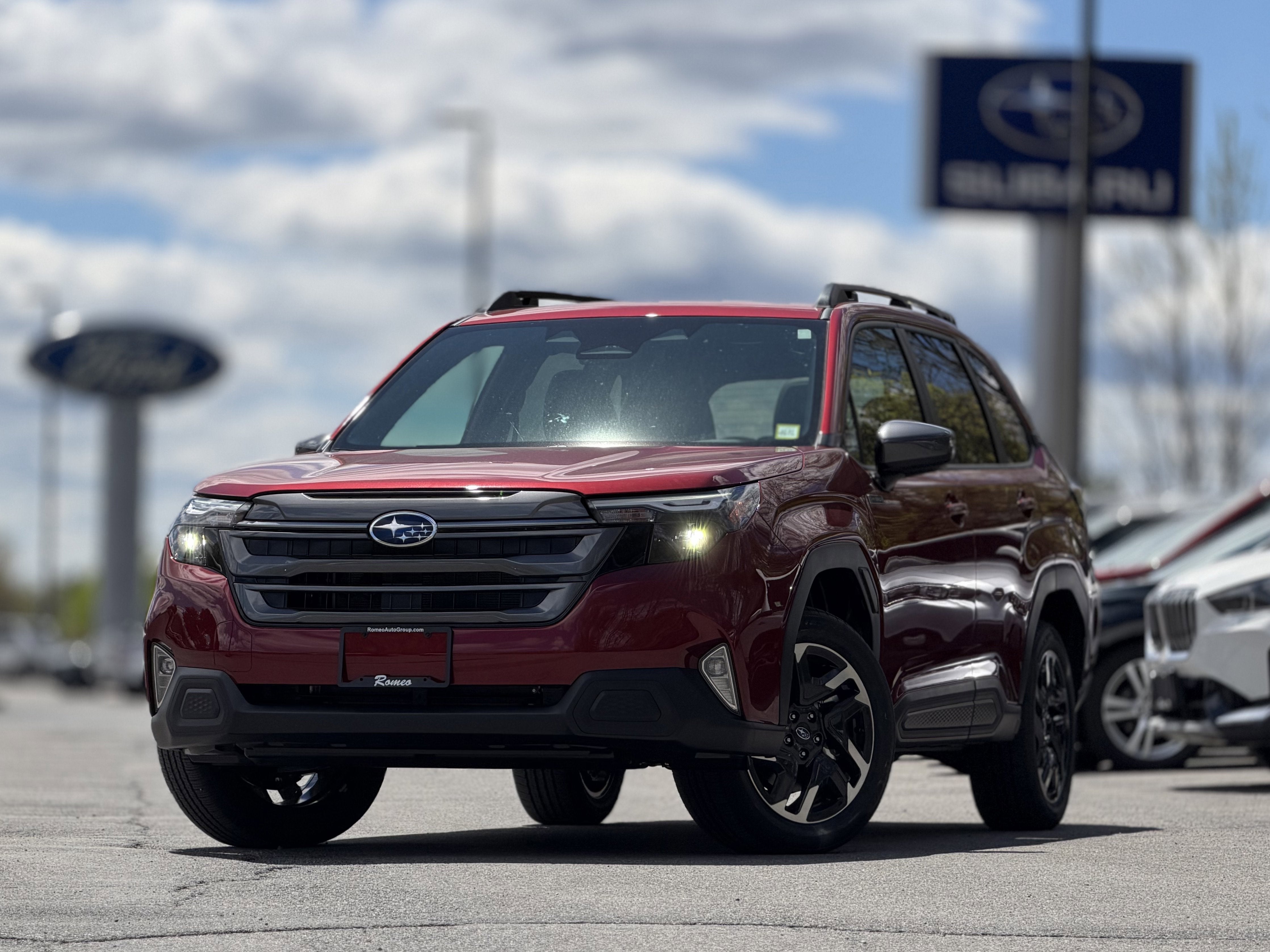 2026 Subaru FORESTER Premium Hybrid in Crimson Red Pearl — front three-quarter view