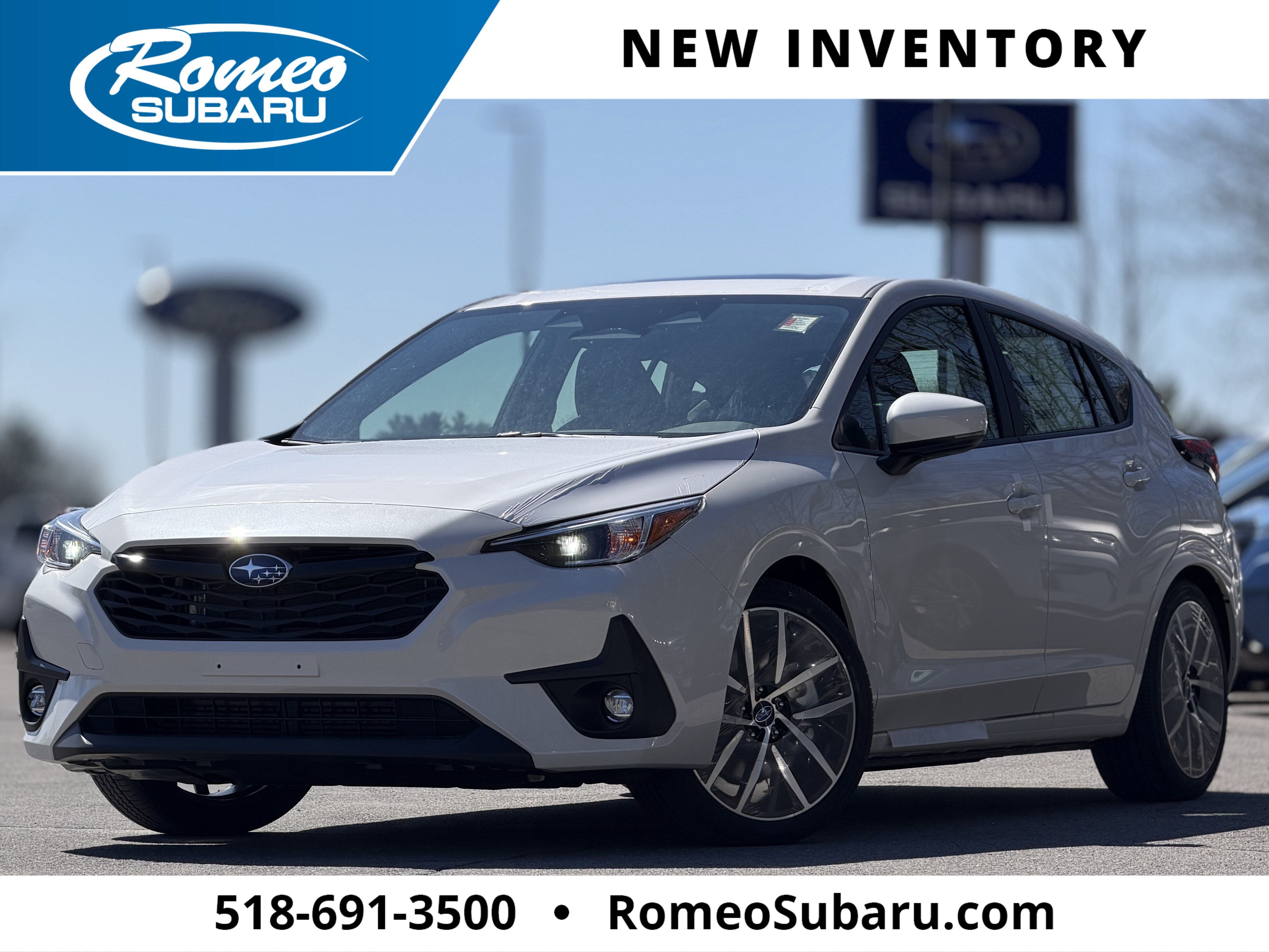 2026 Subaru IMPREZA Sport in Crystal White Pearl — front three-quarter view