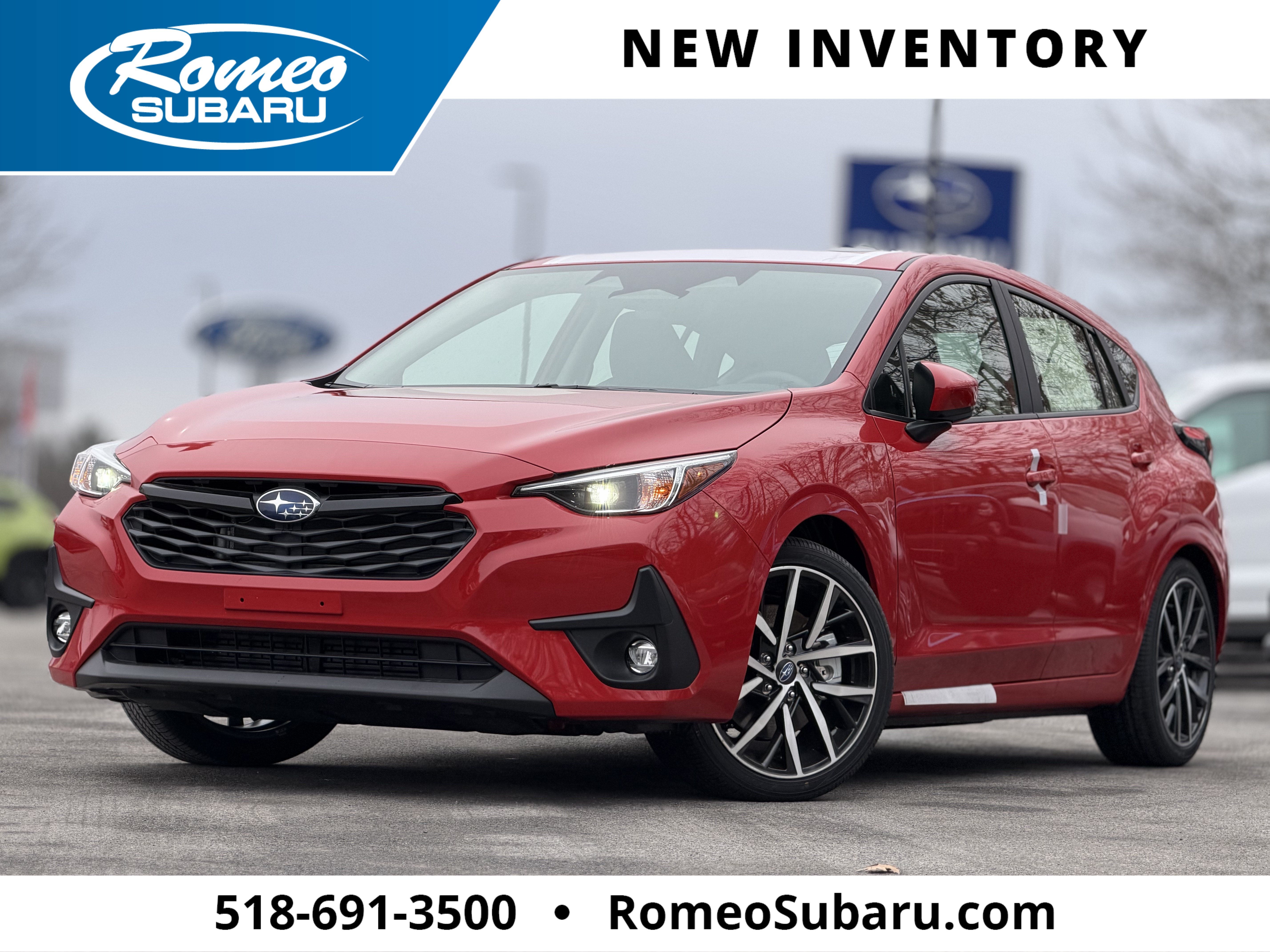 2026 Subaru IMPREZA Sport in Pure Red — front three-quarter view