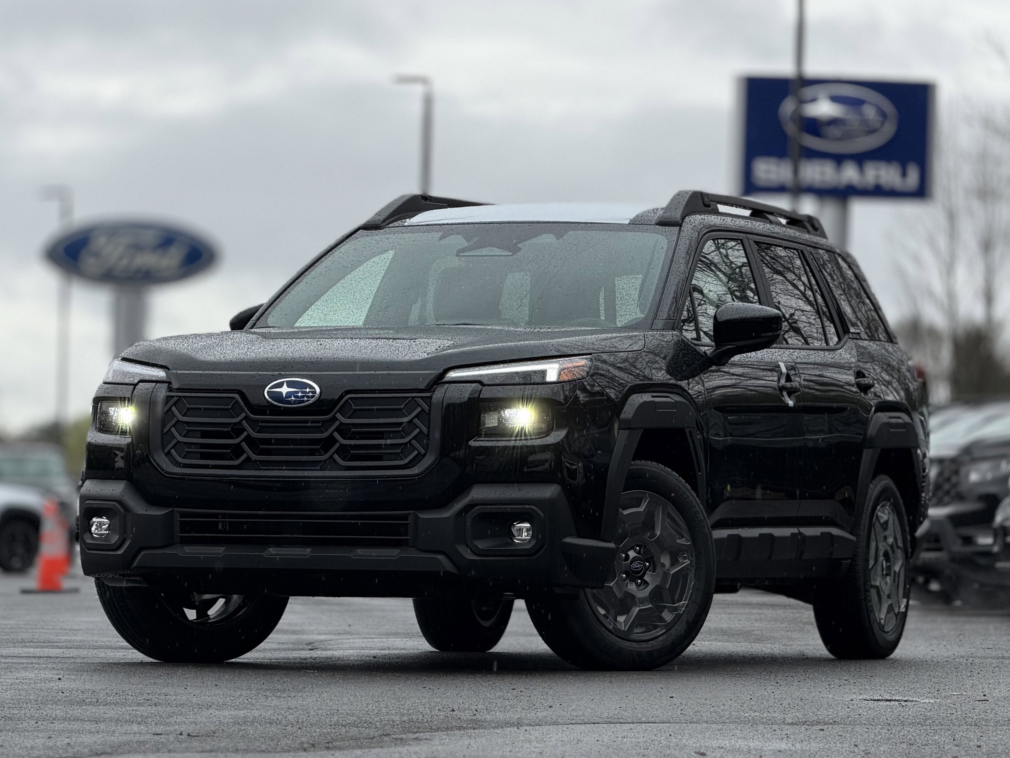 2026 Subaru OUTBACK Premium in Crystal Black Silica — front three-quarter view