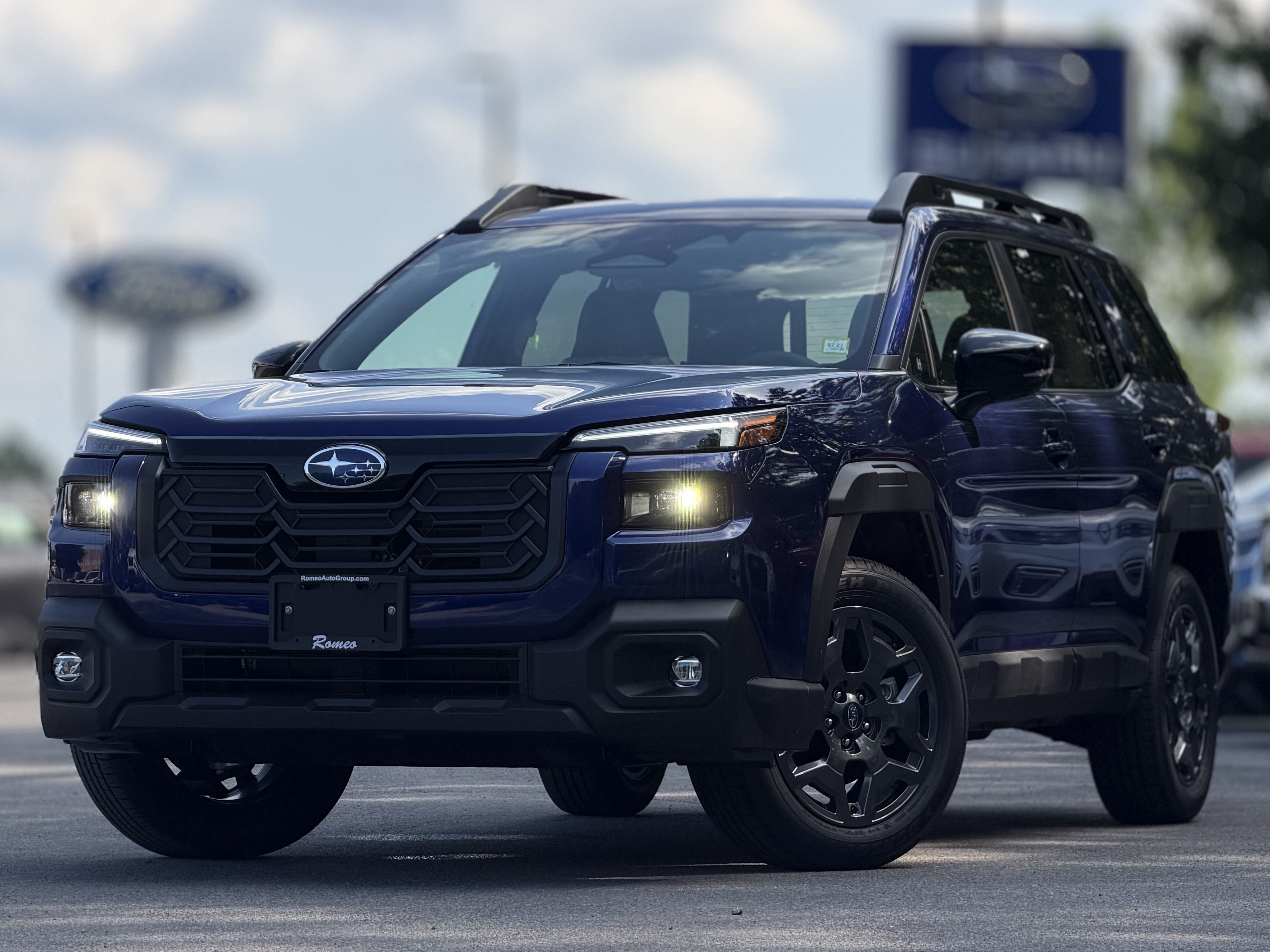 2026 Subaru OUTBACK Premium in Sapphire Blue Pearl — front three-quarter view