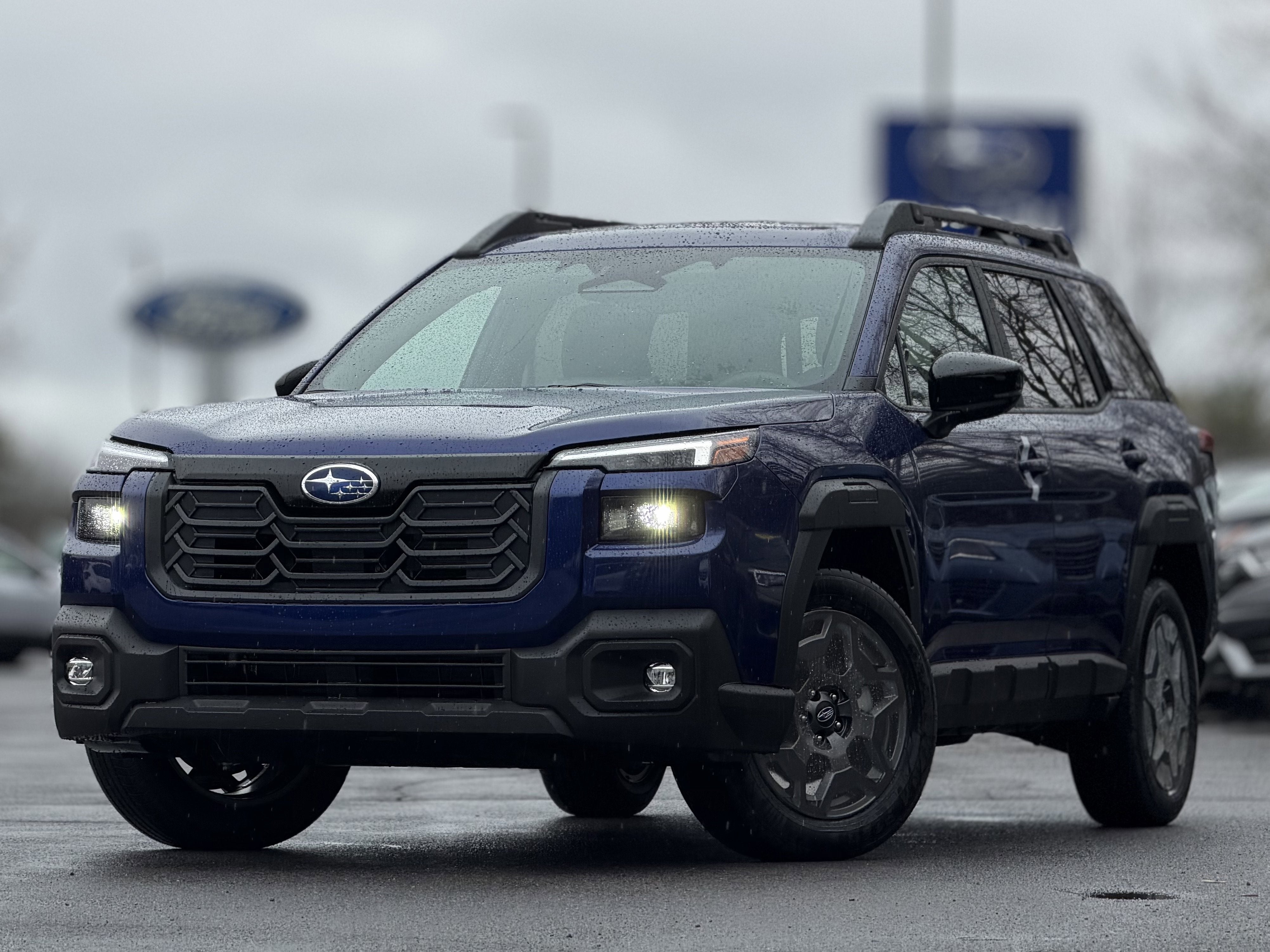 2026 Subaru OUTBACK Premium in Sapphire Blue Pearl — front three-quarter view