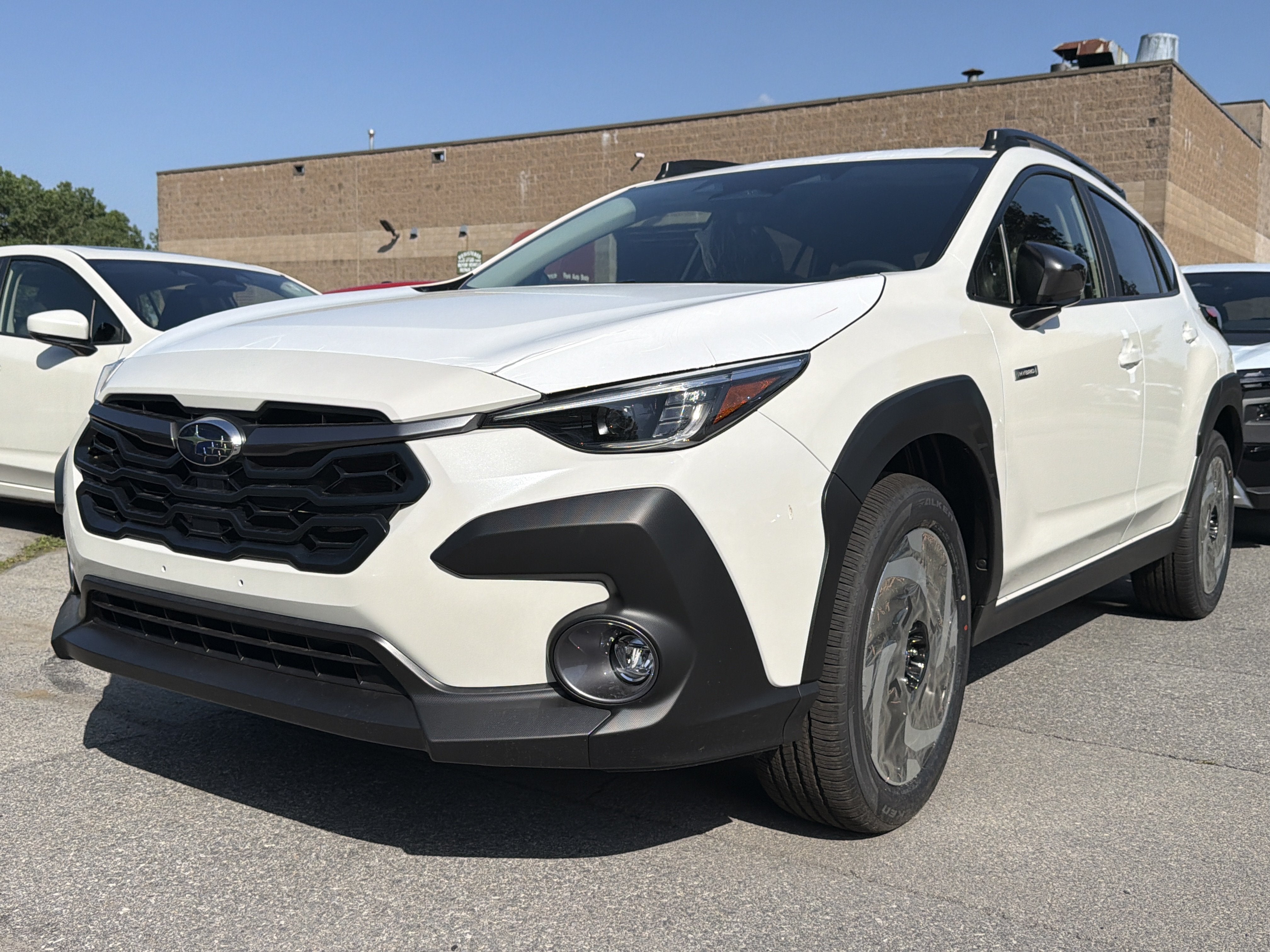 2026 Subaru CROSSTREK Limited Hybrid in Crystal White Pearl — front three-quarter view