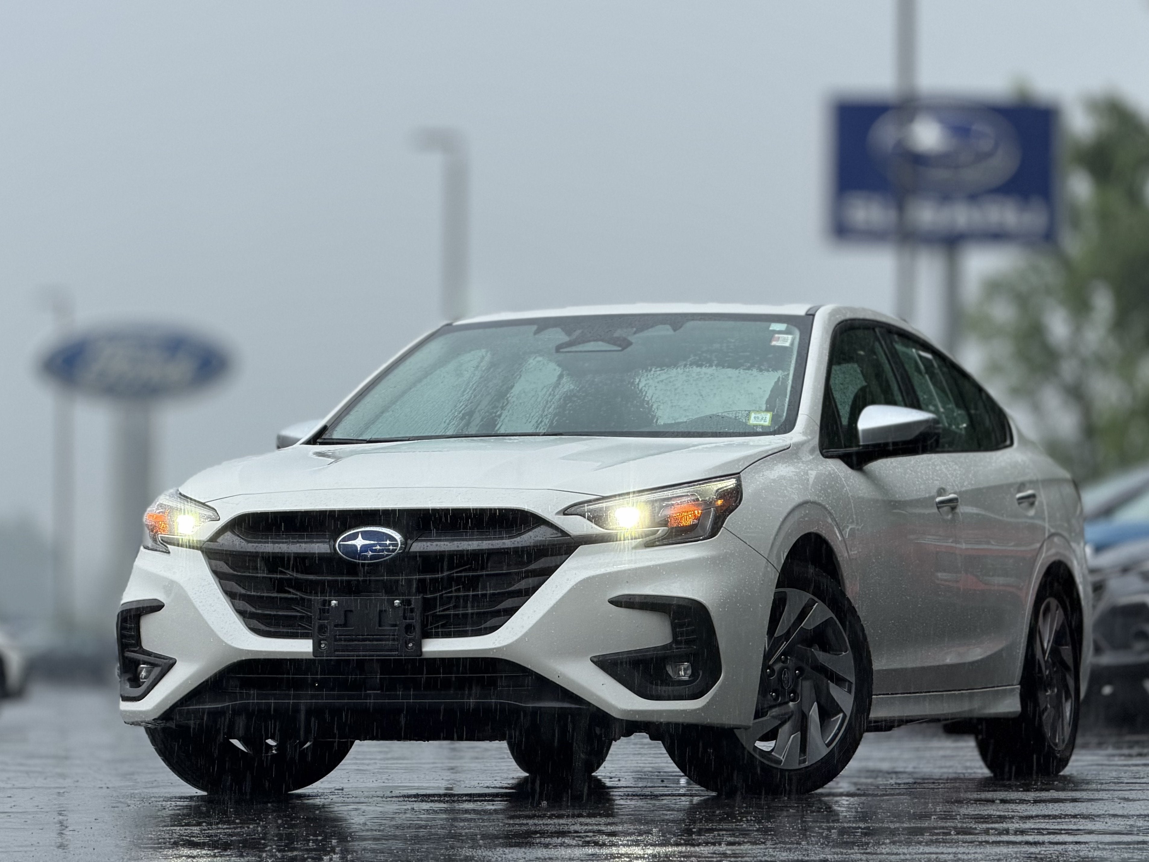 2023 Subaru Legacy Touring XT in Crystal White Pearl — front three-quarter view