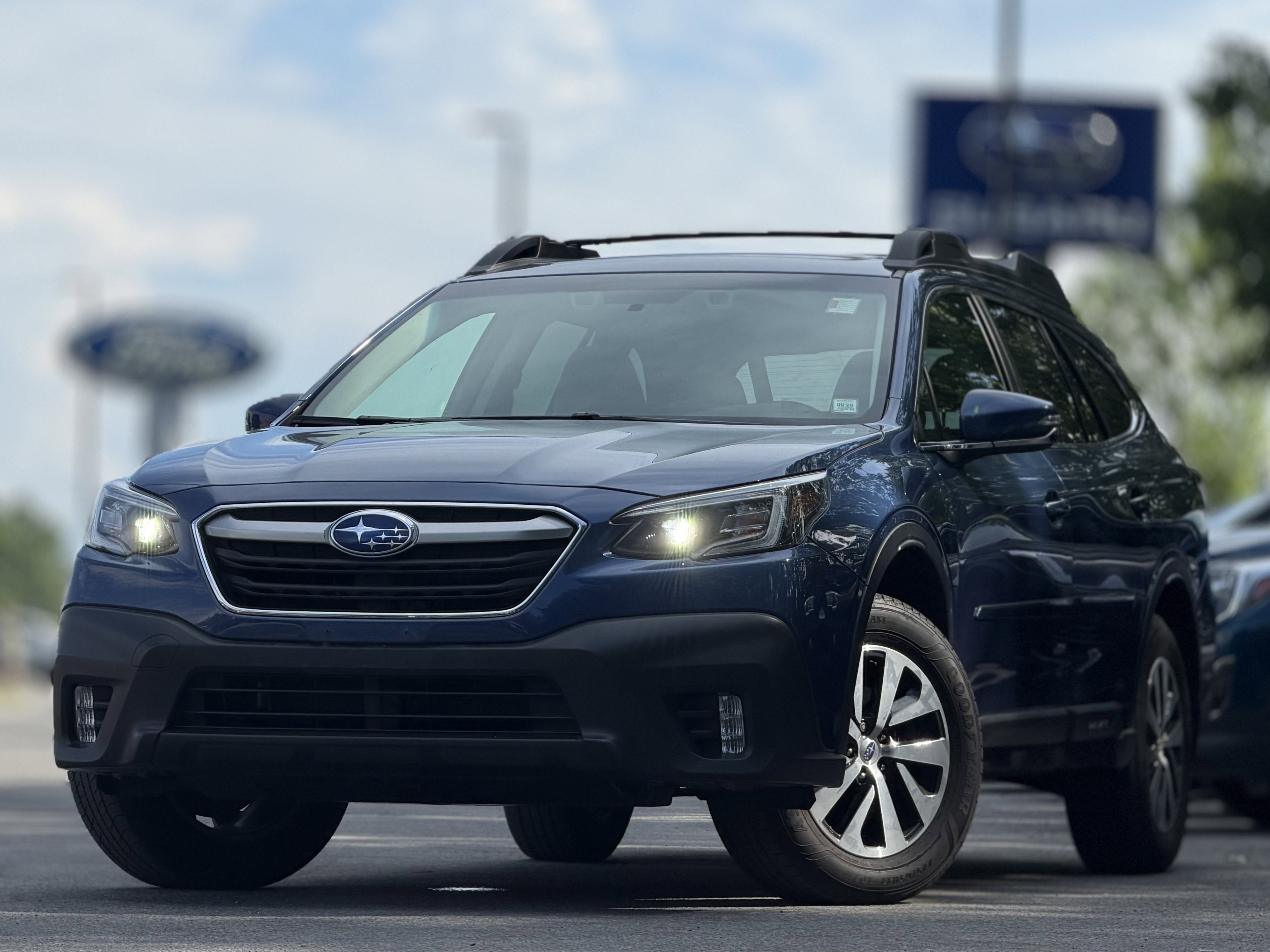 2020 Subaru Outback Premium in Abyss Blue Pearl — front three-quarter view