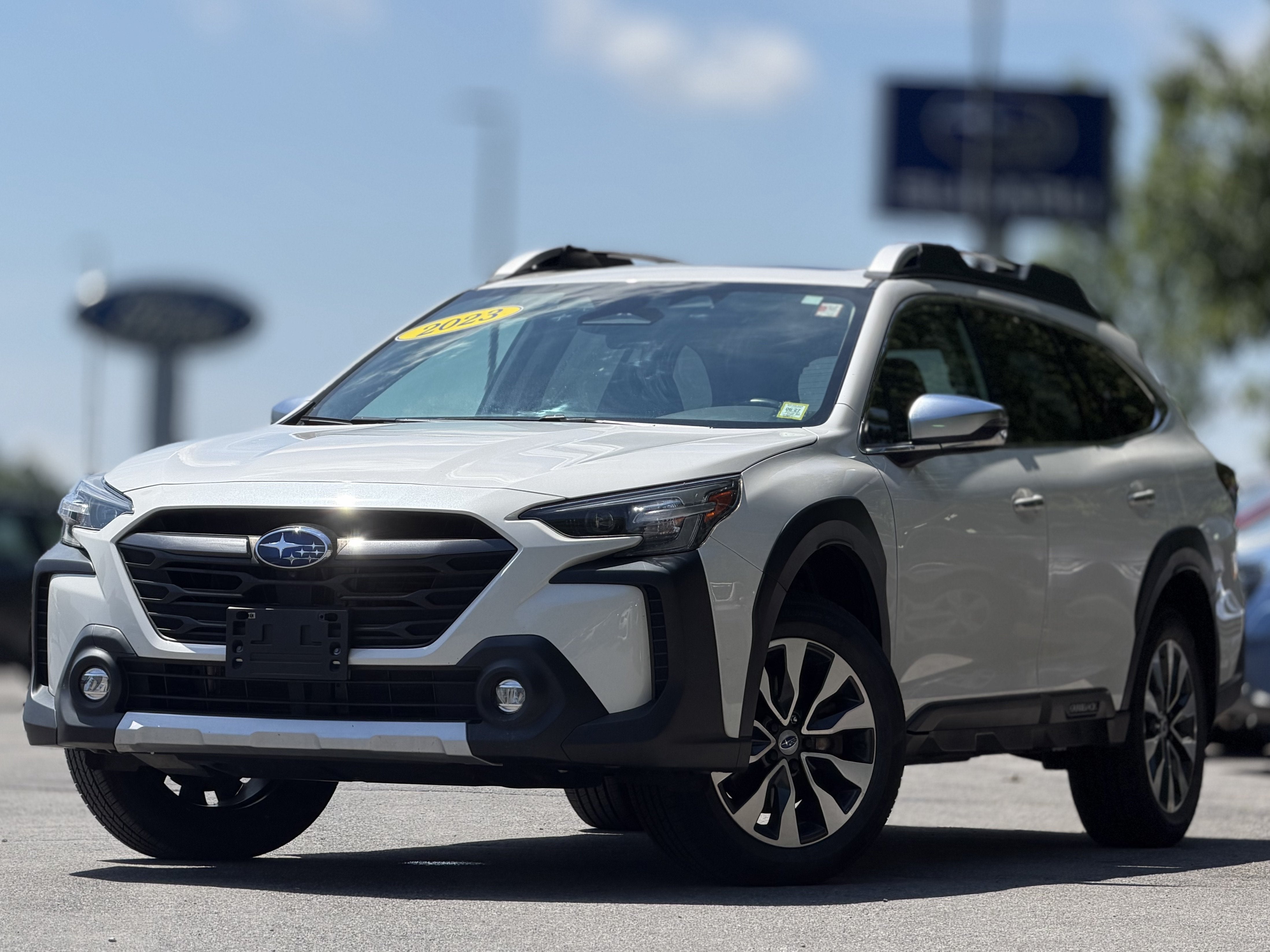 2023 Subaru Outback Touring XT in Crystal White Pearl — front three-quarter view