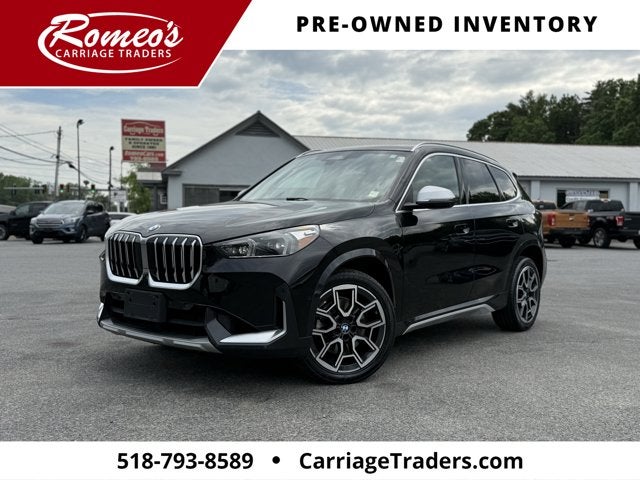 2024 BMW X1 xDrive28i in Black Sapphire Metallic — front three-quarter view