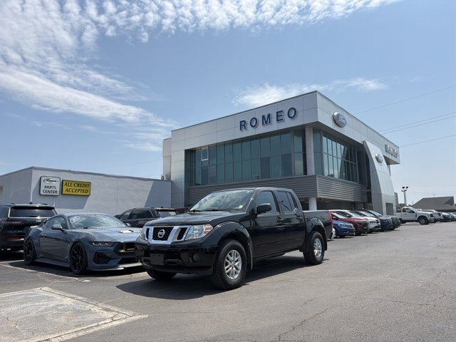 2019 Nissan Frontier SV in Magnetic Black Pearl — front three-quarter view