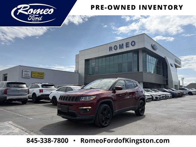 2021 Jeep Compass Latitude in Velvet Red Pearlcoat — front three-quarter view